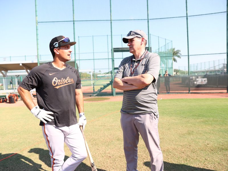 Sig Mejdal (right), vice president and assistant general manager of analytics for the Baltimore Orioles, speaks with Orioles player Adam Frazier. Photo courtesy of Baltimore Orioles.