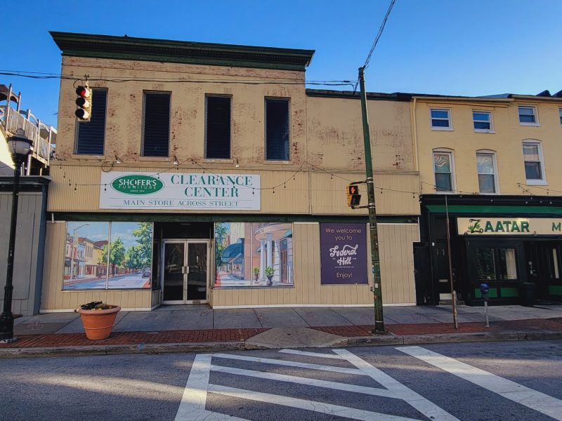 The former Shofer's Furniture Clearance Center, at 107-113 S. Charles St. in Federal Hall, is targeted for demolition by its owner. Photo by Ed Gunts.