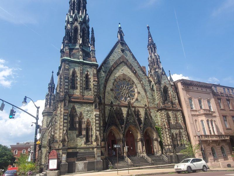 The 1872 church at 2 E. Mount Vernon Place has three spires and an exterior made of six different types of stone. Photo by Ed Gunts.