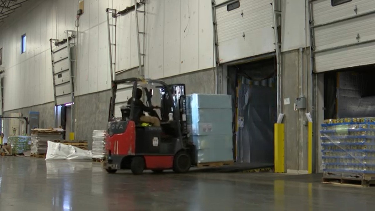 A worker operates machinery at Ace Logistics' warehouse in the Port of Baltimore. Screenshot from video by Elana Mutnick/Capital News Service.