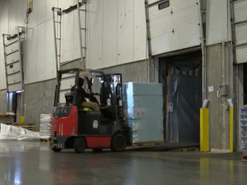 A worker operates machinery at Ace Logistics' warehouse in the Port of Baltimore. Screenshot from video by Elana Mutnick/Capital News Service.