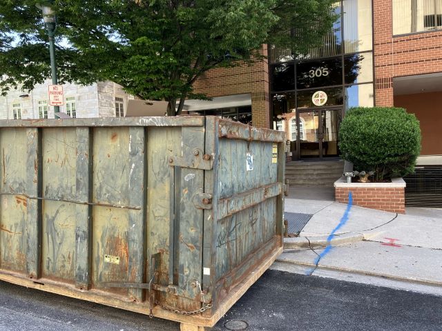 A dumpster is outside Baltimore County's recently purchased office building, which is undergoing nearly $7.5 million in renovations. Photo by John Lee/WYPR.