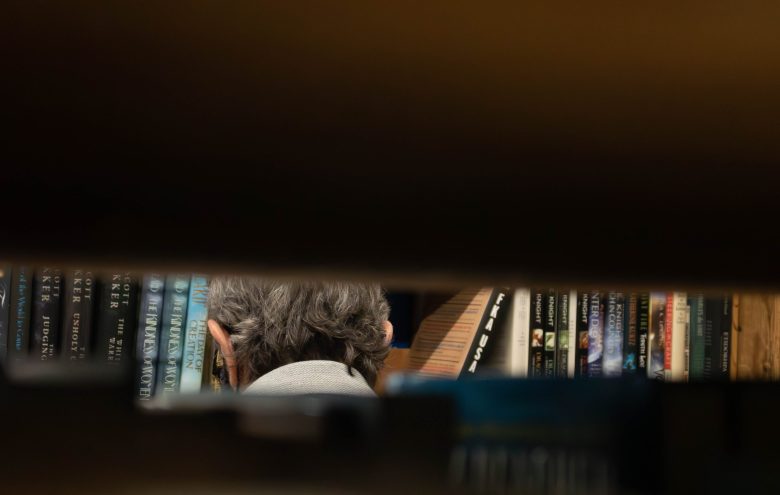 A patron browses books at Normal’s Book and Records in Baltimore, Maryland on Sept. 29, 2024. Photo by Maggie Jones.