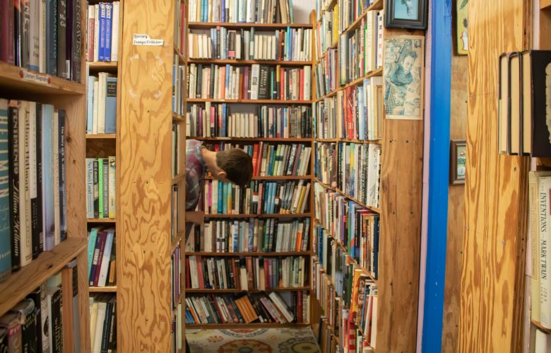 Natalie Neil browses Normal’s Book and Records in Baltimore, Maryland on Sept. 29, 2024. Photo by Maggie Jones.