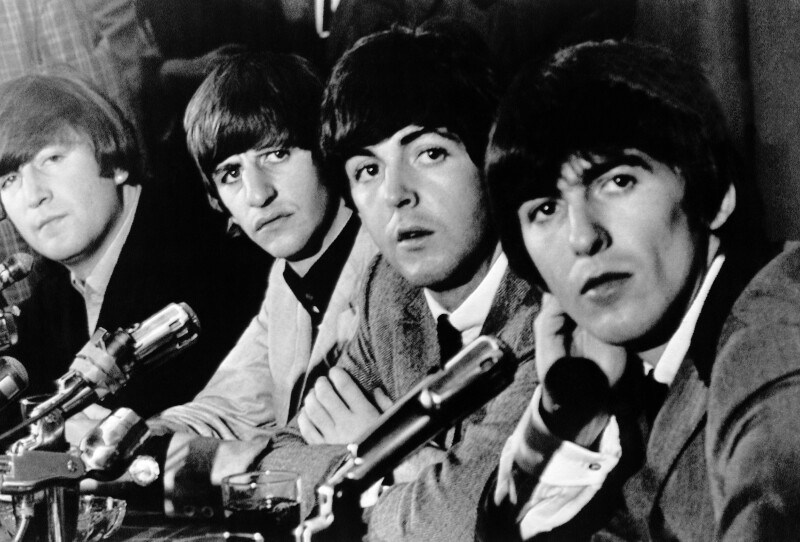 English singing group the Beatles face the press at Delmonico's Hotel, in New York City, on Aug. 29, 1964. From left, John Lennon, Ringo Starr, Paul McCartney and George Harrison. (AP Photo)