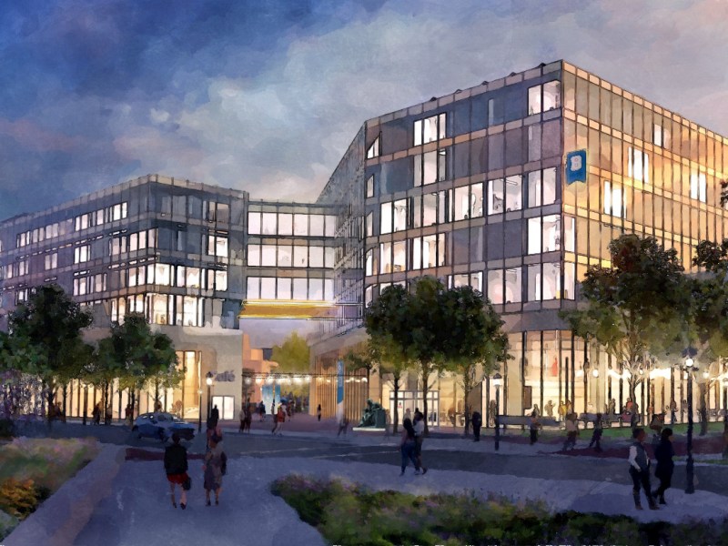 A rendering depicts a large, modern, angular building (the University of Baltimore's planned Center for Learning). Streetlights illuminated the tree-lined street as many people walk around the building at dusk.