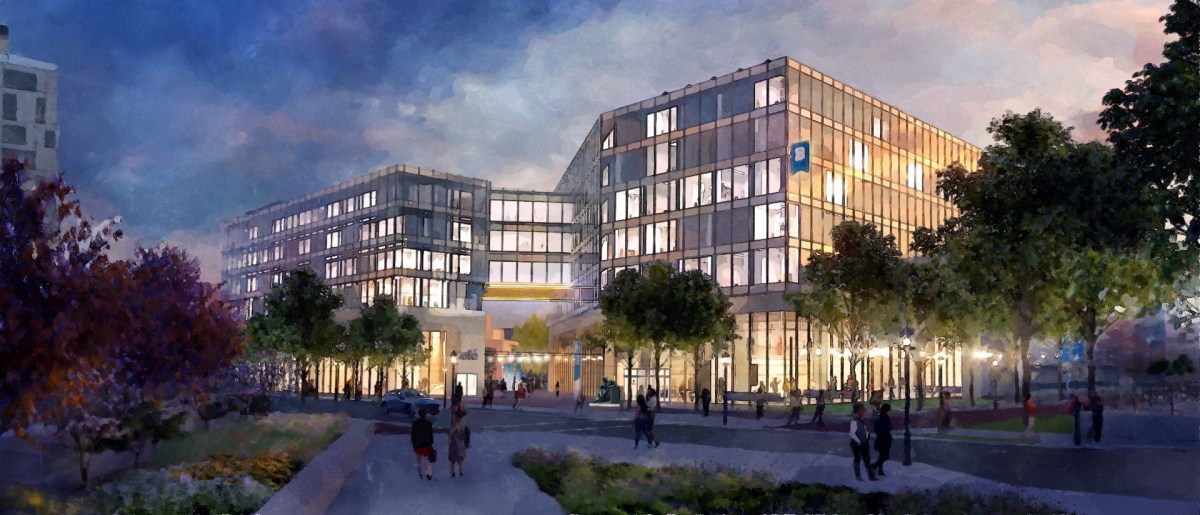 A rendering depicts a large, modern, angular building (the University of Baltimore's planned Center for Learning). Streetlights illuminated the tree-lined street as many people walk around the building at dusk.