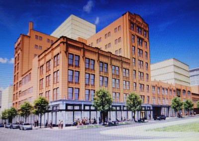 A rendering depicts The Compass with the former Brager Gutman building at Park Avenue and Lexington Street in the foreground. Credit: Westside Partners.