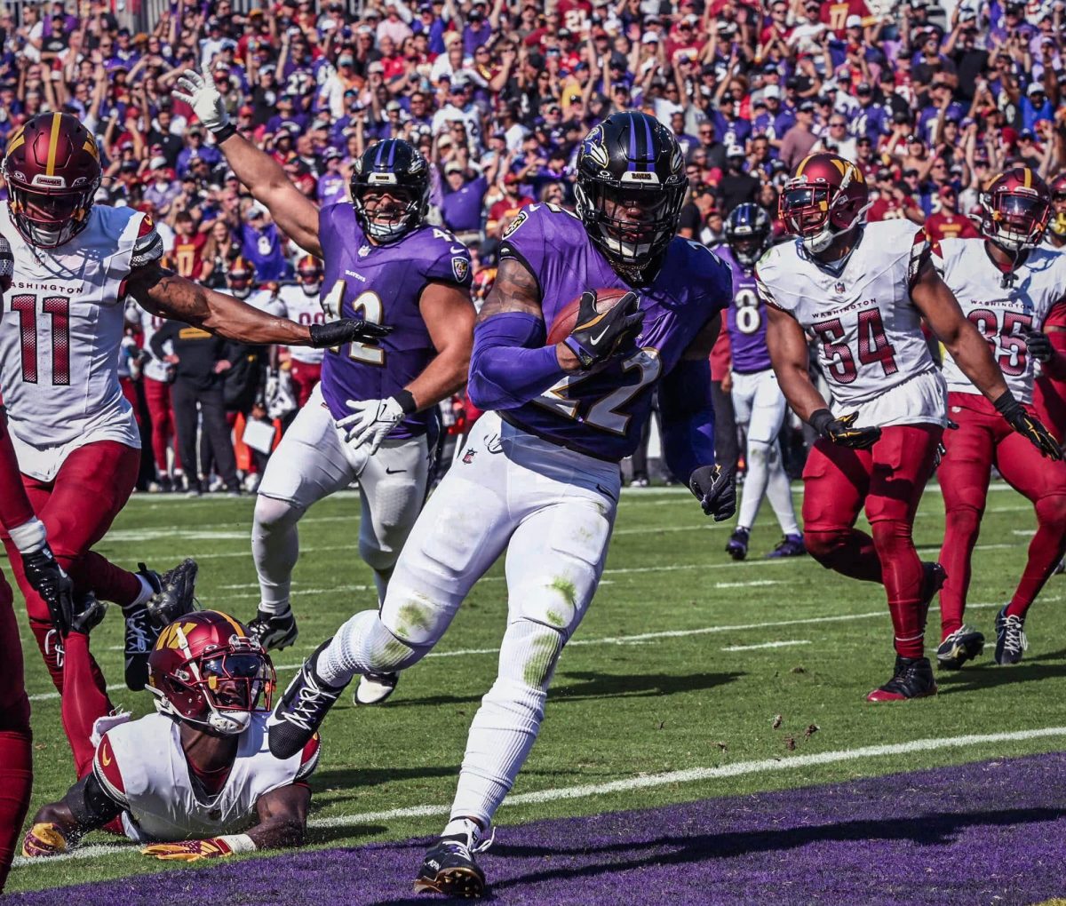 Baltimore Ravens running back Derrick Henry runs the ball in a game against the Washington Commanders. Photo courtesy of Baltimore Ravens.