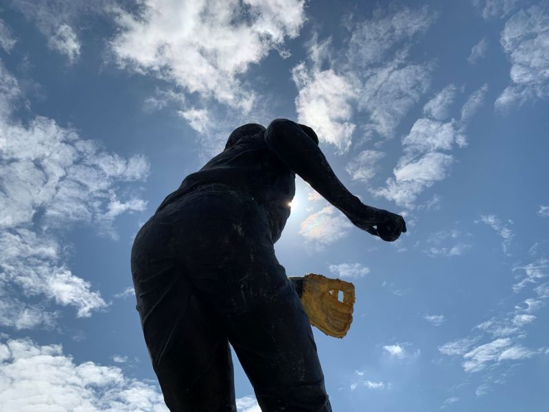 The sun shines bright on the Brooks Robinson statue across from Camden Yards the day after his passing. Photo credit: Macon Street Books.