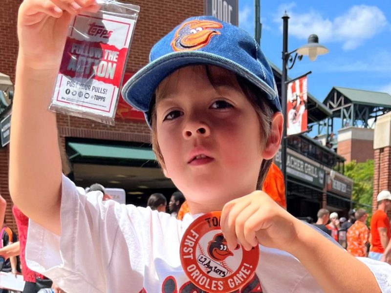 Gus Squires with his "First Orioles Game" button before the first pitch at Camden Yards on Aug. 27, 2023. Photo credit: Sofia Alvarez.