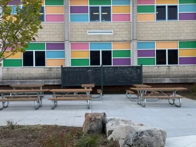 A chalkboard and picnic tables are part of the new outdoor classroom at Cecil Community Park.