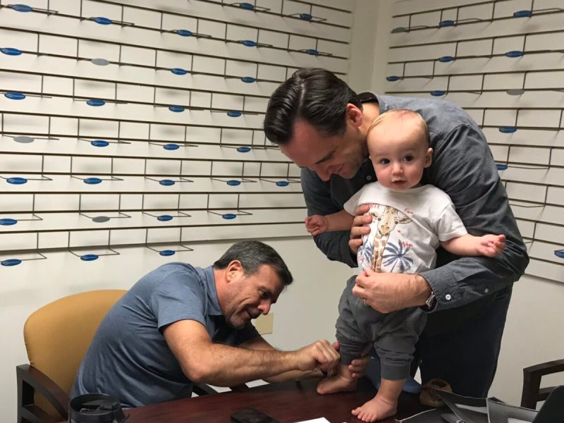 Mike Gugat (left_, cofounder and CEO of jbrds, researches shoes with his son. (Courtesy jbrds)