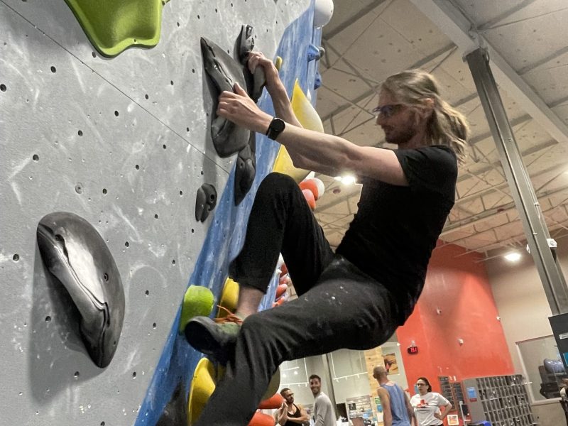 Doug McKenney, 36, of Towson, participates in a queer climbing night at Movement Hampden.