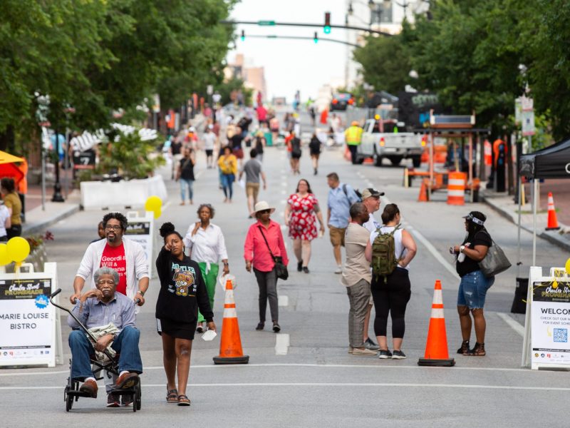 Pedestrians enjoy Charles Street without car traffic during a previous year's Charles Street Promenade. Photo courtesy of Charles Street Promenade.