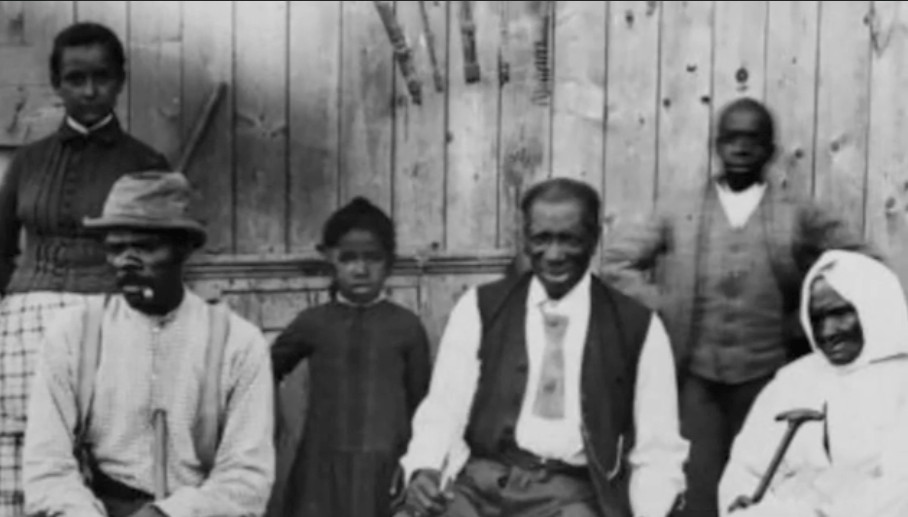 Black and white photo of Black family in 19th century.