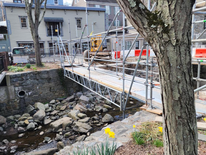 Tiber stream with walkway over it and scaffolding