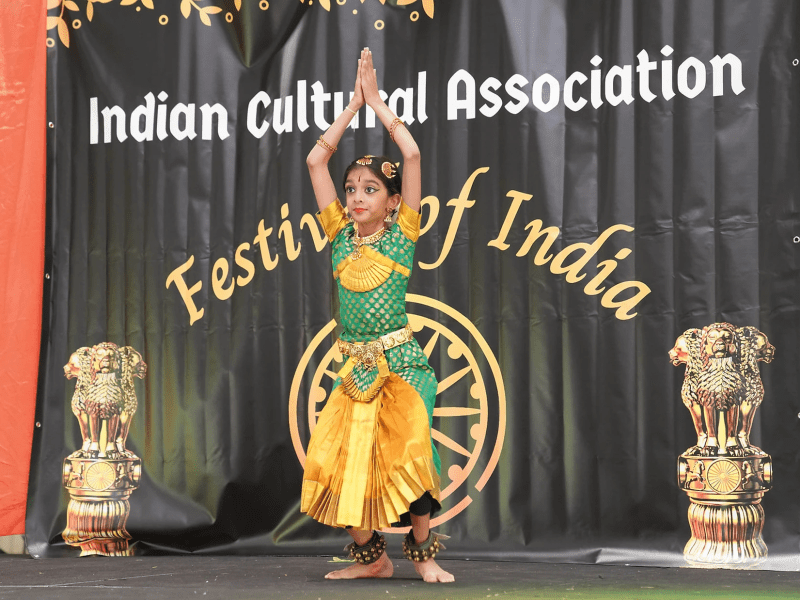 girl in traditional indian garb strikes pose in fashion show