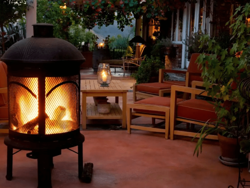 Cozy outdoor scene, outdoor fireplace on screened in porch